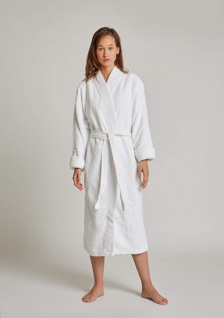 Humana White woman is wearing Humana White bathrobe