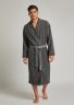 Man is wearing Humana charcoal bathrobe