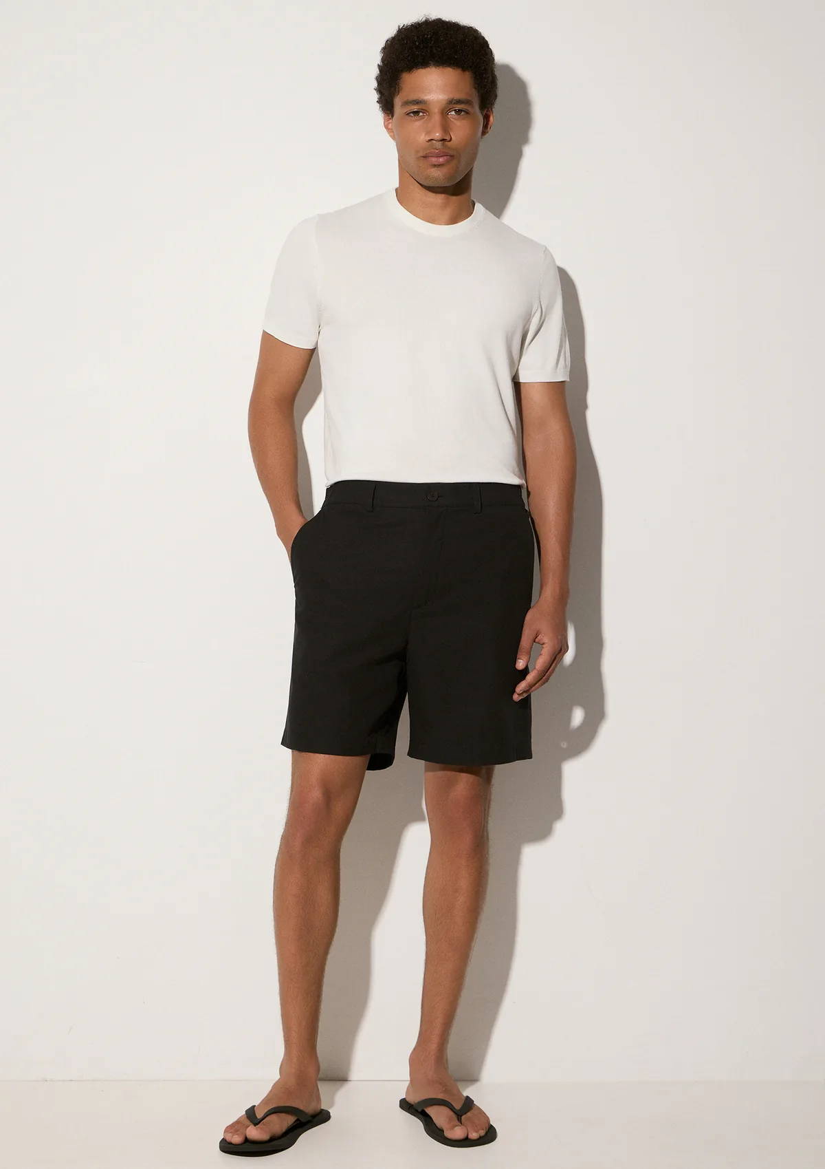 lorain-lyocell-shorts-black-lifestyle-front Lorain Lyocell Shorts - Black - Sea You Soon