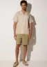 pekan-tencel-shirt-beige-lifestyle-front Additional angle of Pekan TENCEL™ TENCEL™ shirt in Sand on white background by Sea You Soon