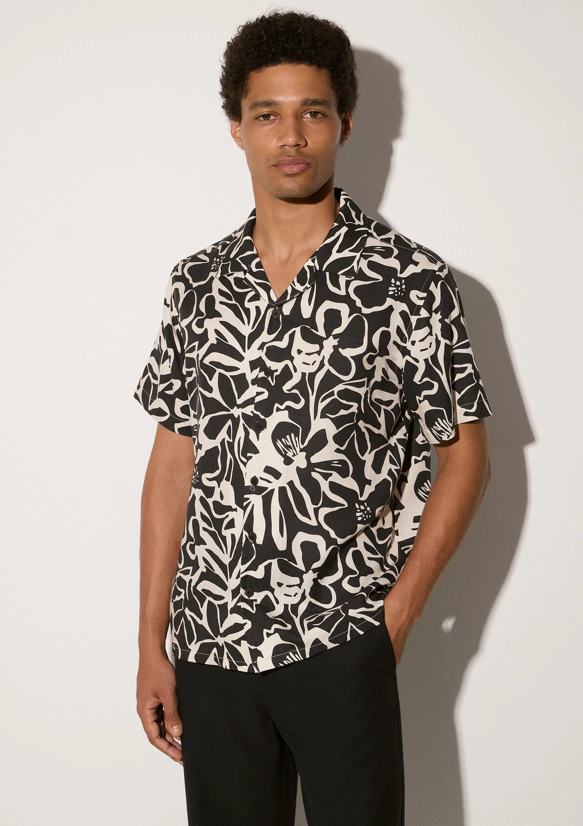 saporo-tencel-shirt-black-lifestyle-side Saporo TENCEL™ shirt in Black TENCEL™, studio product shot by Sea You Soon, designed in Greece
